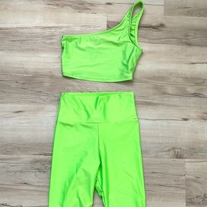 Neon green top & biker shorts.